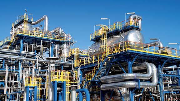 Pipes and tankers in an oil rig