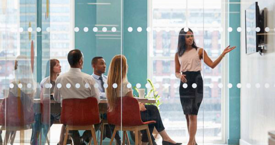 Businesswoman giving her colleagues a presentation in a conference room