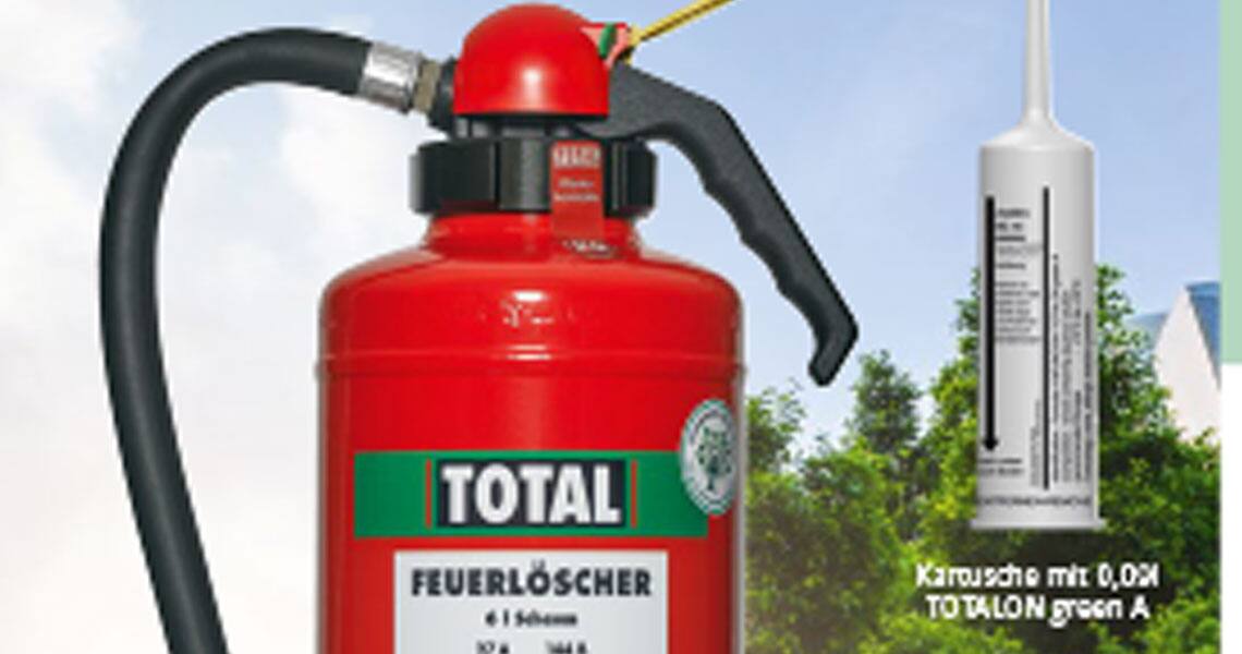 A fluorine-free extinguishing agent and a cartridge system overlaid on an image of buildings surrounded by greenery