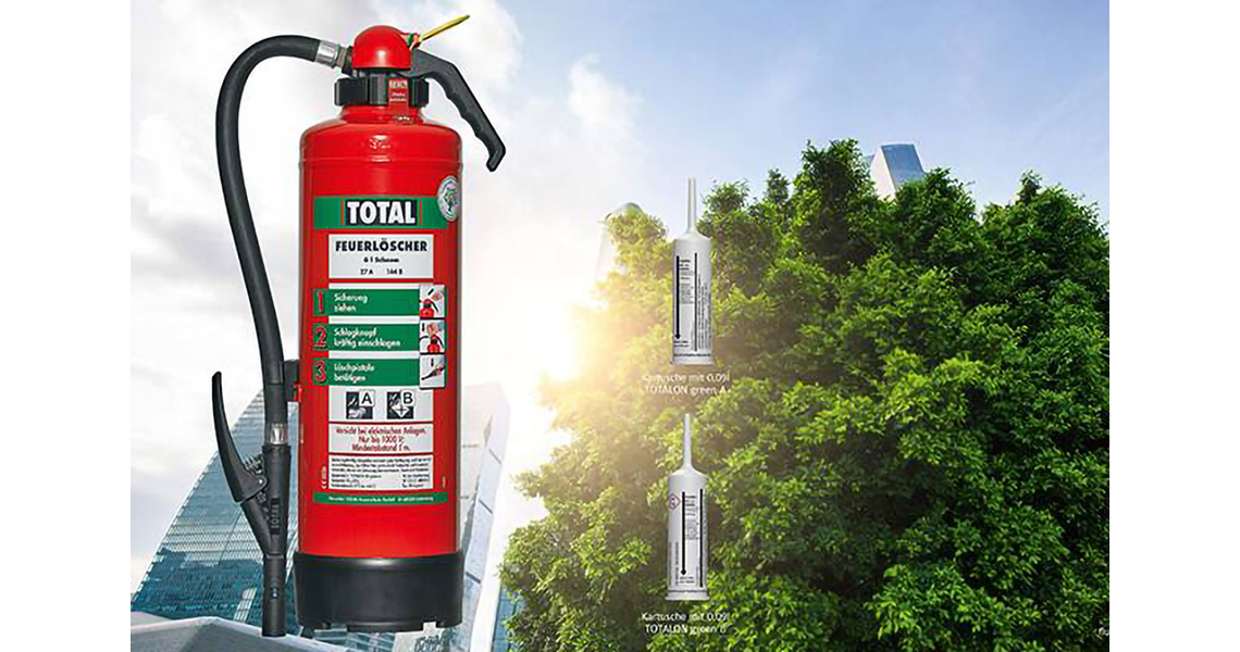 A fluorine-free extinguishing agent and a cartridge system overlaid on an image of buildings surrounded by greenery
