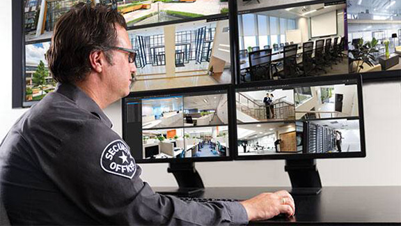 A security person watching the cctv footages