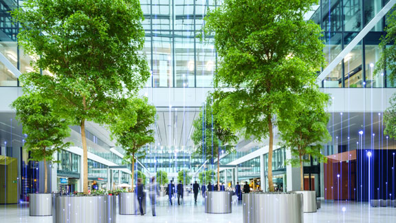 Lobby of a commercial building, overlaid with a graphic of transmission nodes