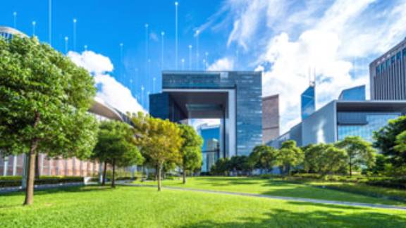 Office buildings at daytime, surrounded by greenery